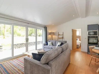 a living room with a couch and a table at Corning Mill View in Ulverston