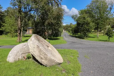 a large rock sitting on the side of a road at The Burrow in Ulverston