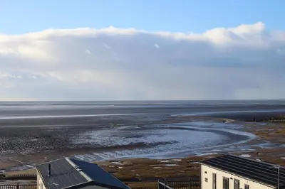 an aerial view of the ocean and a beach at The Rivington Lodge in Heysham