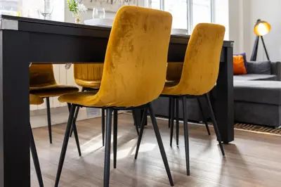 a dining room table with yellow chairs at Flatzy - 16 Guests 4 En-suite Central Apartment B in Liverpool
