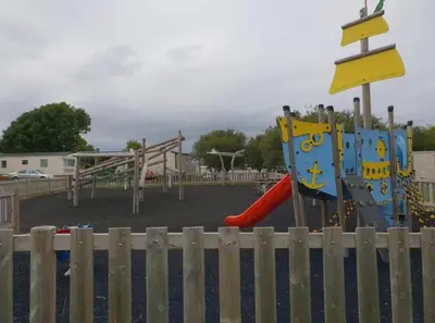 a park with a playground with a slide and a slideintend at 136, Port Haverigg in Millom