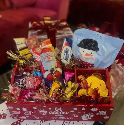 a box of christmas candy and santa clauses on a table at Blackpool Rocks Pleasure Beach in Blackpool