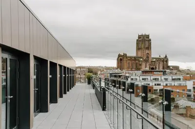 a view of a city from the balcony of a building at The Halyard Liverpool, Vignette Collection by IHG in Liverpool