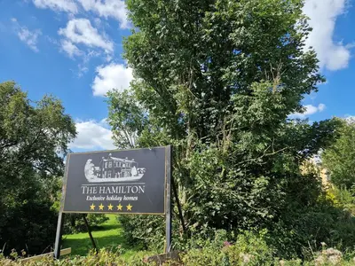 a sign in front of a tree at The Duke in Preston