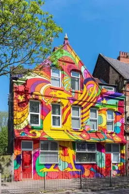 a colorful house with a painting on the side of it at LFC Themed Apartment in Liverpool