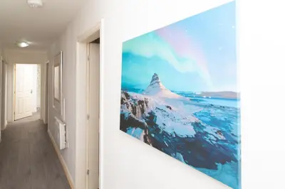 a hallway with a wall mural of a mountain at Central Liverpool Haven 3 bedroom House Private Parking in Liverpool