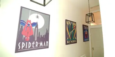 a hallway with posters on the walls of a room at Stylish Double Room in City Centre - Shared Bathroom - Parking in Preston