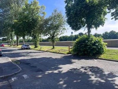 a car parked on the side of a street with trees at Riverside by Teil Luxurious one bed Apartment in Preston