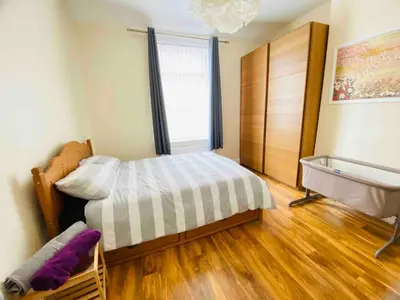a small bedroom with a bed and a window at Cozy Retreat Haven in Liverpool