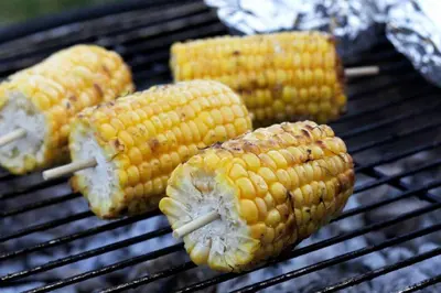 four corn on the cob on a grill at Curlew - Bleasdale in Chipping
