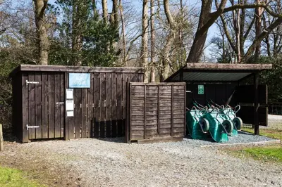 a wooden shed with graffiti on the side of it at Mallard - Bleasdale in Chipping