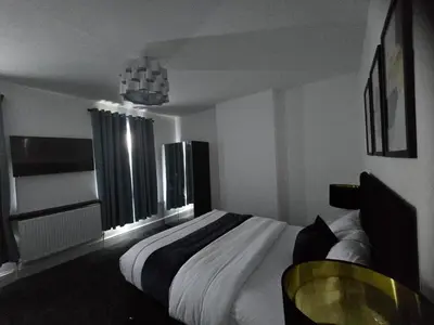 a bedroom with a large bed and a window at Seaside Retreat on Fleet Street in Blackpool