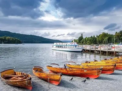 a group of boats sitting on the shore of a lake at Uk46866 - Hawkshead in Ulverston