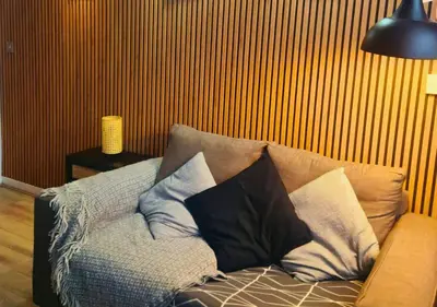 a couch with pillows on it in a living room at Heritage Bank Liverpool Near Cavern sleeps 3 in Liverpool