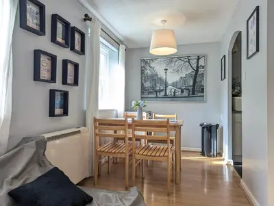 a dining room with a table and chairs at City Centre Vintage Theme Guest Rooms in Liverpool