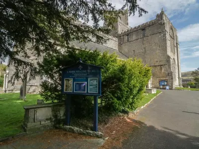 a blue sign in front of a building at Edgemere Hideaway in Grange Over Sands