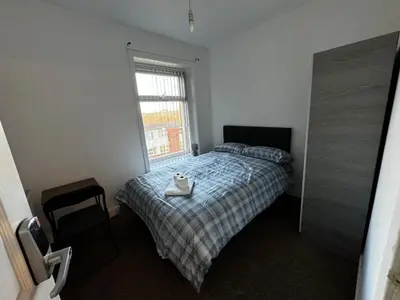 a bedroom with a bed with a tray on it at Double bed BW4 Accrington Burnley in Accrington