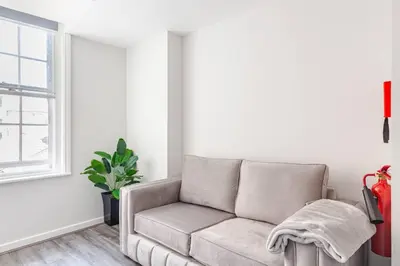 a living room with a couch and a window at Modern 1-Bedroom City Centre Apartment, Liverpool Hideaway in Liverpool