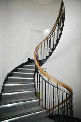 a staircase with black and wooden railings in a building at Liverpool City Stay 1-Bed apartment with 2 Sofa Beds, Sleeps up to 6 in Liverpool