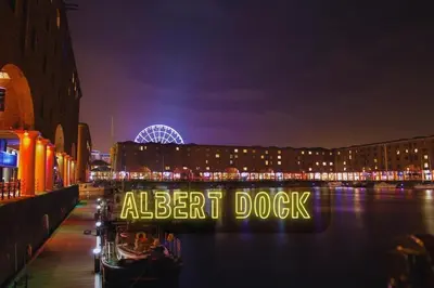 a sign that reads alert dock on a river at night at Liverpool Serviced Apartment - Mallow in Liverpool