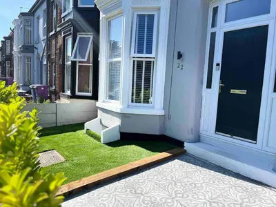 a front door of a house with green grass at Flat3 large modern king Bed flat private bathroom ryan's place in Walton on the Hill