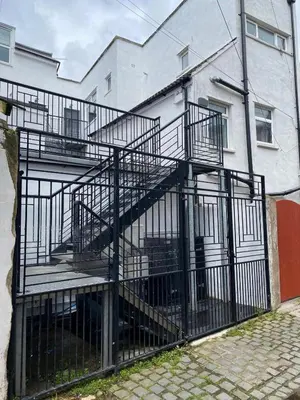 a metal staircase in front of a building at Clock Tower Apartments No3 in Morecambe