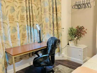 a room with a desk with a computer on it at Room 1 Shared House in Bootle in Litherland