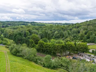 an overhead view of a forest of trees at Lodge 1 in Carnforth