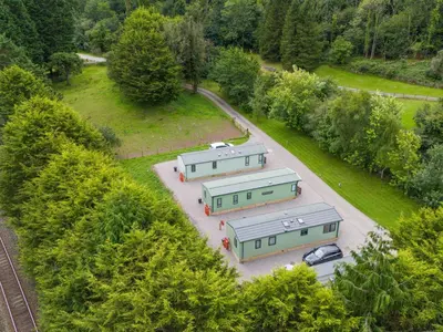 an overhead view of three trailers in a parking lot at Lodge 2 in Carnforth