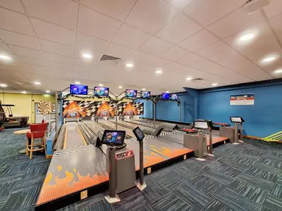 a bowling alley with pins and a game room at The Pepperpot - Uk49156 in Silverdale