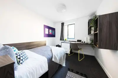a bedroom with a bed and a desk at Prospect Point in Liverpool in Liverpool
