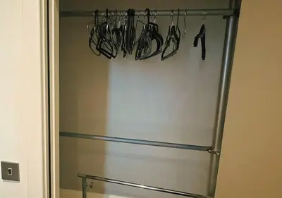 a stainless steel refrigerator with utensils hanging from it at The Vault Liverpool City Centre sleeps 4 in Liverpool