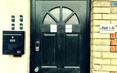 a black door with a sign in front of it at Lodginet Stays - County View - 1BR Flat 4 in Liverpool