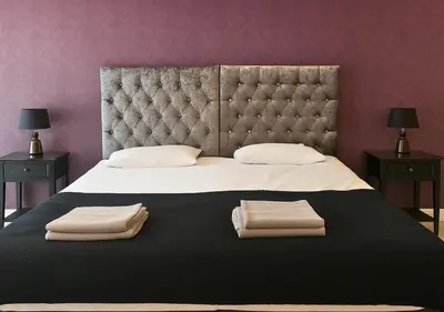 a bedroom with a large bed with two towels on it at Urban Nest Liverpool Near Cavern Quarter sleeps in Liverpool
