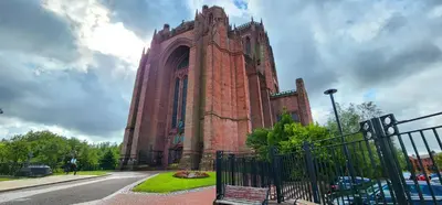 a large brick building with a bench in front of it at 2 Mins to Cathedral Georgian Quarter CityBreak in Liverpool