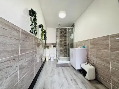 a bathroom with two sinks and a shower at Pembroke Place Private Room 1 in Liverpool