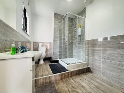 a bathroom with a shower and a sink and a toilet at Pembroke Place Private Room 7 in Liverpool