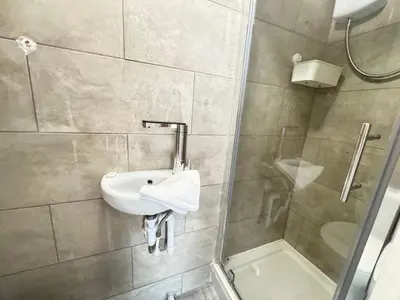 a bathroom with a sink and a shower at Bold Street Studio I in Liverpool