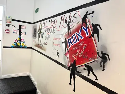 a mural of surfers on a wall in a room at Bold Street Studio IV in Liverpool