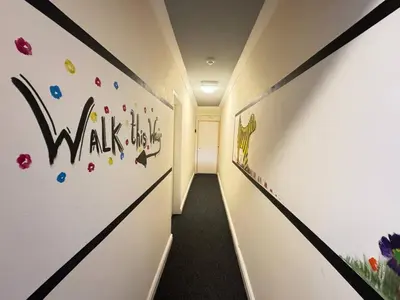 a hallway with a wall with the words walk at Bold Street Studio V in Liverpool