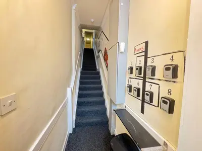 a long hallway with stairs in a building at Bold Street Studio V in Liverpool