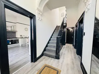 a hallway with a staircase in a house at Pembroke Place Private Room 5B in Liverpool