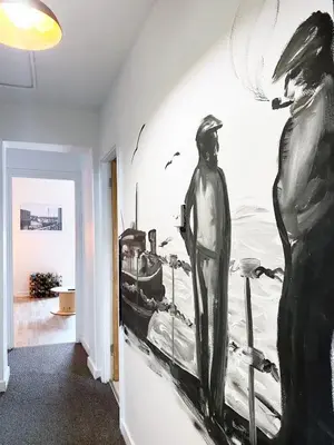 a room with a painting on the wall at The Docklands XL by Serviced Living Liverpool in Liverpool