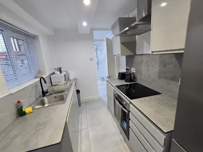 a kitchen with a sink and a counter top at Room 1 Shared house 5 min from Sefton Park in Liverpool