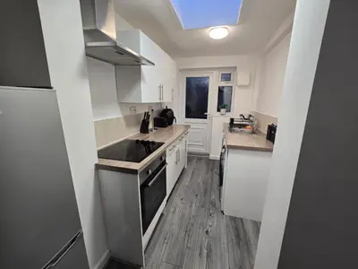a kitchen with a sink and a stove top oven at Room 2 Shared House 3 min from Stadium in Liverpool