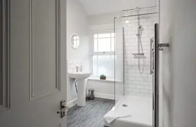 a white bathroom with a sink and a shower at Ribby Stays - 2 bed Cottage Pet Friendly in Wrea Green