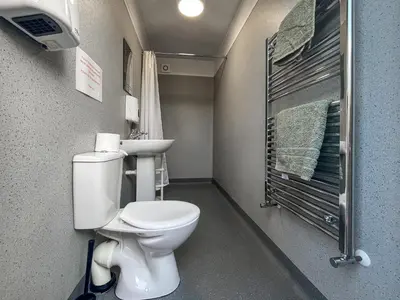 a small bathroom with a toilet and a sink at Hardknot - Uk48484 in Dalton in Furness