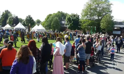 a large crowd of people standing around in a park at Spacious Ormskirk Contractor Stay by PolkaStays in Ormskirk