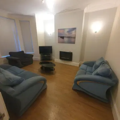 a living room with two couches and a tv at Mount Pleasant Town House Gem in Barrow