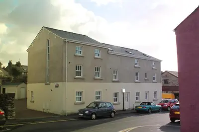 a large building on the side of a street at 2 Laurel Court in Ulverston